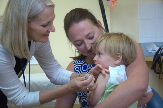 Local infant Liam gets his flu shot.