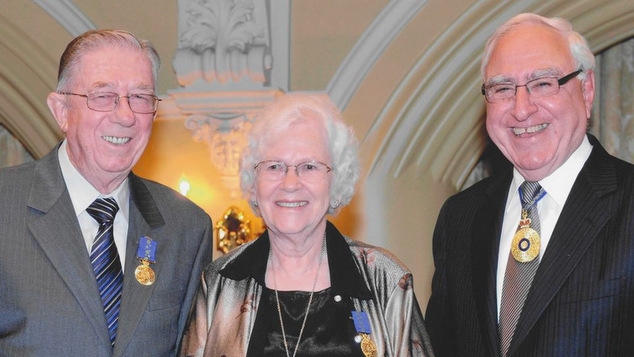 John and Margaret Pugh (left) receive the Medal of the Order of Australia from Governor Ken Micheal.