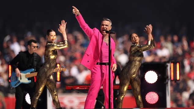 MELBOURNE, AUSTRALIA - SEPTEMBER 24: Robbie Williams performs during the 2022 AFL Grand Final match between the Geelong Cats and the Sydney Swans at the Melbourne Cricket Ground on September 24, 2022 in Melbourne, Australia. (Photo by Cameron Spencer/AFL Photos)