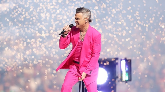 MELBOURNE, AUSTRALIA - SEPTEMBER 24: Robbie Williams performs in the pre-game entertainment before the 2022 AFL Grand Final match between the Geelong Cats and the Sydney Swans at the Melbourne Cricket Ground on September 24, 2022 in Melbourne, Australia. (Photo by Mark Kolbe/AFL Photos)